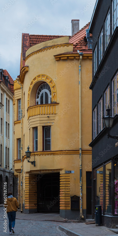 Fototapeta premium A man walking in the streets of Tallinn, Estonia