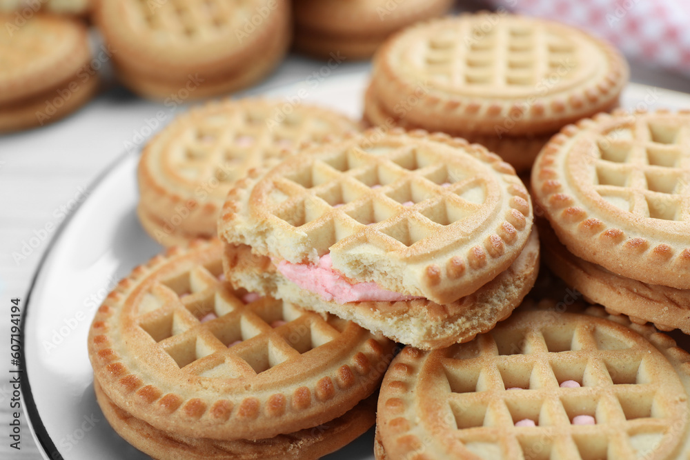 Tasty sandwich cookies with cream on plate, closeup Tasty sandwich cookies with cream on plate, closeup