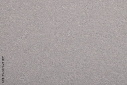 Texture of light grey paper sheet as background, top view