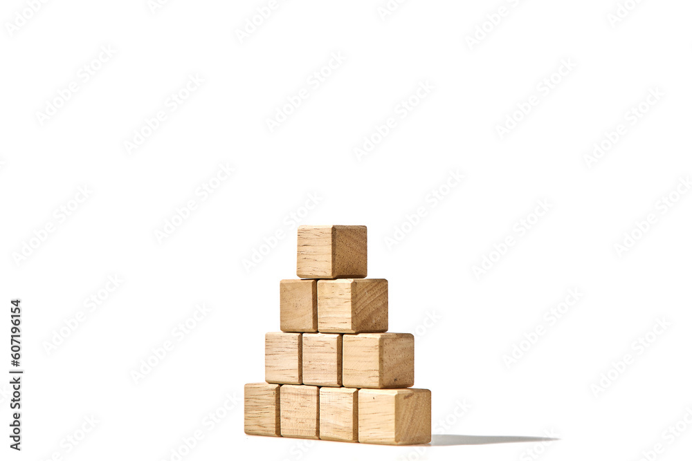 Wood cubes arranged in the pyramid shape on white Wood cubes arranged in the pyramid shape on white
