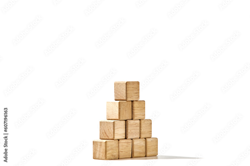 Wood cubes arranged in the pyramid shape on white Wood cubes arranged in the pyramid shape on white