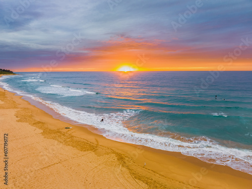 Aerial sunrise at the seaside with cloud cover