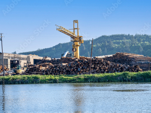 Large Industrial Crane at Logging mill lumberyard along the Yaquina River near the Oregon coast.