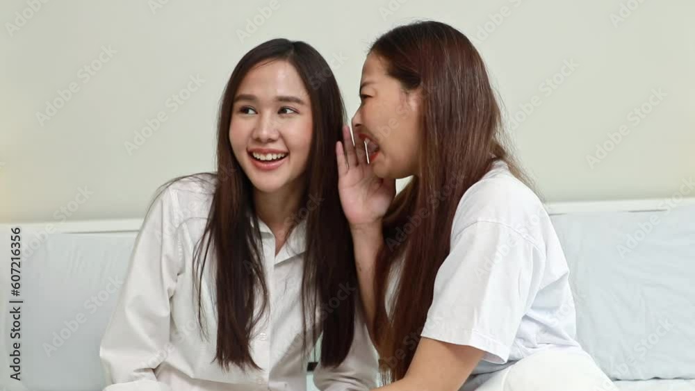 Gossip before bed in the bedroom at home : Intimate female friends sit and chat about secrets, funny gossip, talk about slander to another friend in order to believe in negative stories. Gossip before bed in the bedroom at home : Intimate female friends sit and chat about secrets, funny gossip, talk about slander to another friend in order to believe in negative stories.