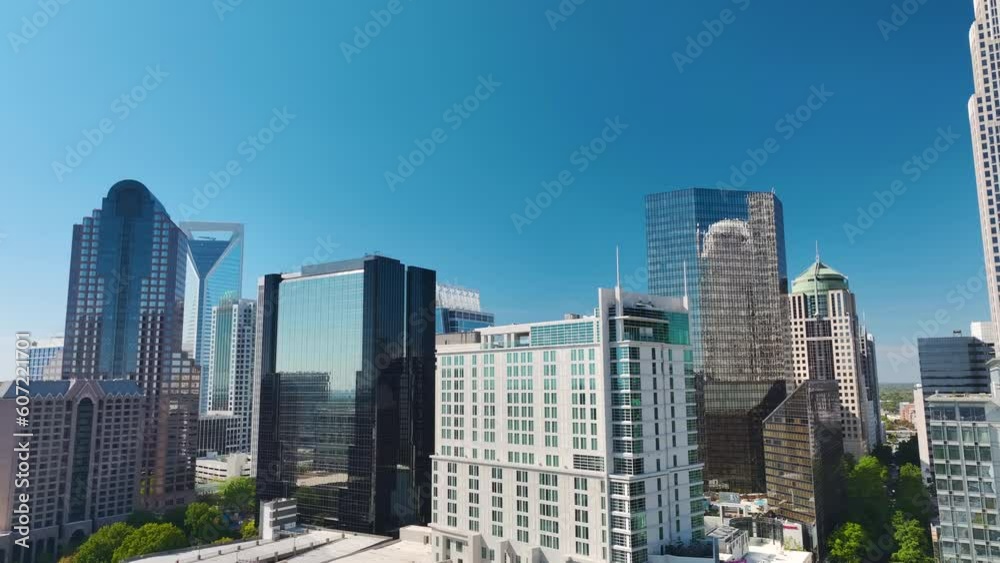 Aerial view of downtown district of Charlotte city in North Carolina, USA. Glass and steel high skyscraper buildings in modern american midtown Aerial view of downtown district of Charlotte city in North Carolina, USA. Glass and steel high skyscraper buildings in modern american midtown
