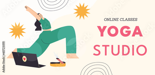 Yong woman watching online yoga classes on laptop, practicing yoga at home.