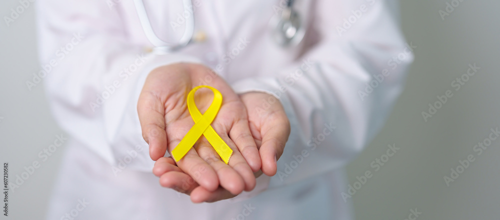 Yellow September, Suicide prevention day, Childhood, Sarcoma, bone and bladder cancer Awareness month, Yellow Ribbon for supporting people life and illness. Healthcare and World cancer day concept Yellow September, Suicide prevention day, Childhood, Sarcoma, bone and bladder cancer Awareness month, Yellow Ribbon for supporting people life and illness. Healthcare and World cancer day concept