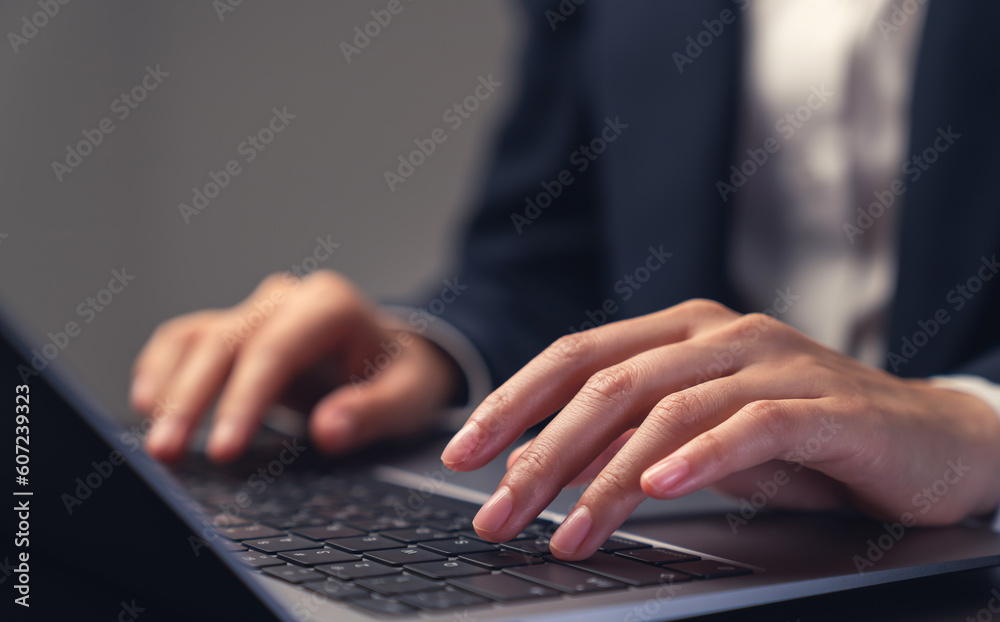 Businessman using laptop and hand typing on the computer keyboard in the office. Businessman using laptop and hand typing on the computer keyboard in the office.