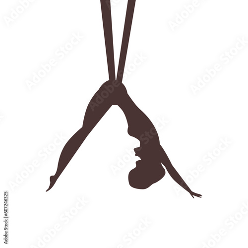 Black silhouette of flexible woman practicing aerial yoga flat style