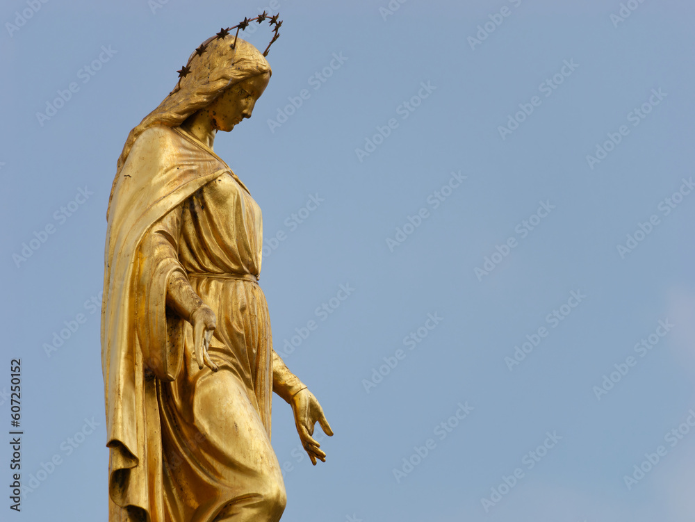Close-up photo of a Holy Mary on top of a column with angels placed in front of Zagreb Cathedral in Kaptol, Zagreb, Croatia	