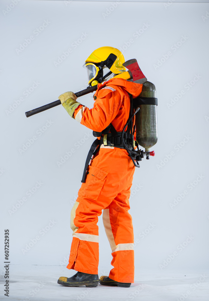 The presence of the iron axe in the professional firefighter's hand symbolizes their preparedness to combat fires and perform critical rescue operations. The presence of the iron axe in the professional firefighter's hand symbolizes their preparedness to combat fires and perform critical rescue operations.