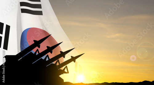 The missiles are aimed at the sky with South Korea flag against the sunset. EPS10 vector