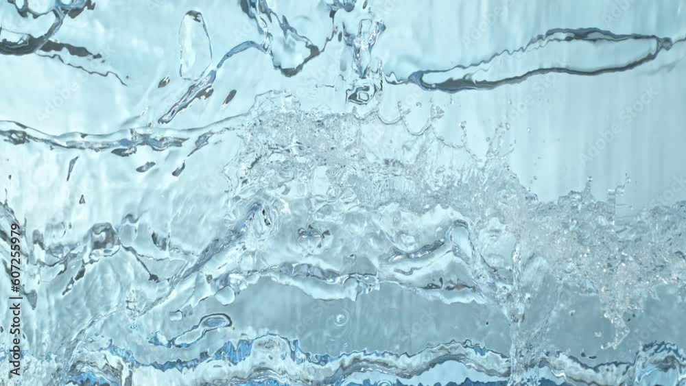Super Slow Motion Shot of Clear Water Wave Splash on Light Blue Background at 1000fps. Super Slow Motion Shot of Clear Water Wave Splash on Light Blue Background at 1000fps.
