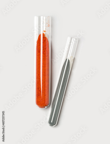 Potassium Ferricyanide and Zinc Powder in test tube. Closeup chemical ingredient on white laboratory table. photo