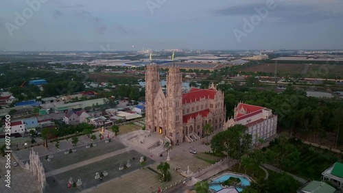 Drone view Song Vinh cathedral lights on in sunrise - Tan Thanh district, Ba Ria Vung Tau province, south Vietnam photo