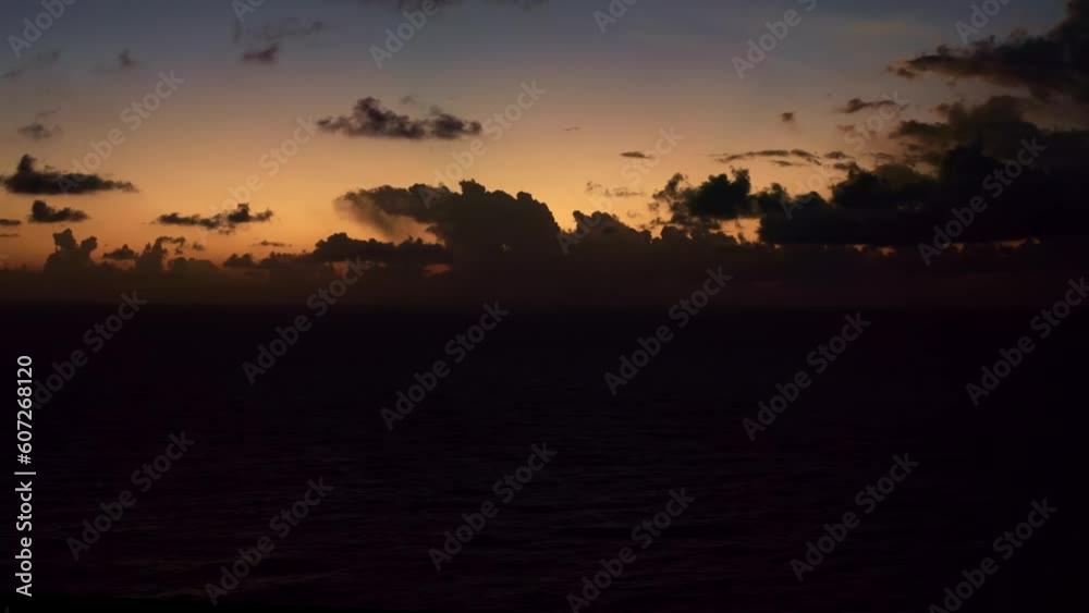 Aerial drone wide shot of small ocean waves during a beautiful summer golden sunrise on the tropical famous Sibauma beach in Tibau do Sul, the state of Rio Grande do Norte, Northeastern Brazil