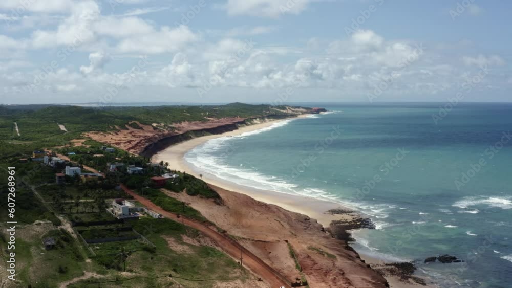 Dolly in aerial drone shot of the stunning tropical Northeast Brazil coastline with golden sand and turquoise water in the small beach town of Sibauma in Tibau do Sul, Rio Grande do Norte, Brazil Dolly in aerial drone shot of the stunning tropical Northeast Brazil coastline with golden sand and turquoise water in the small beach town of Sibauma in Tibau do Sul, Rio Grande do Norte, Brazil