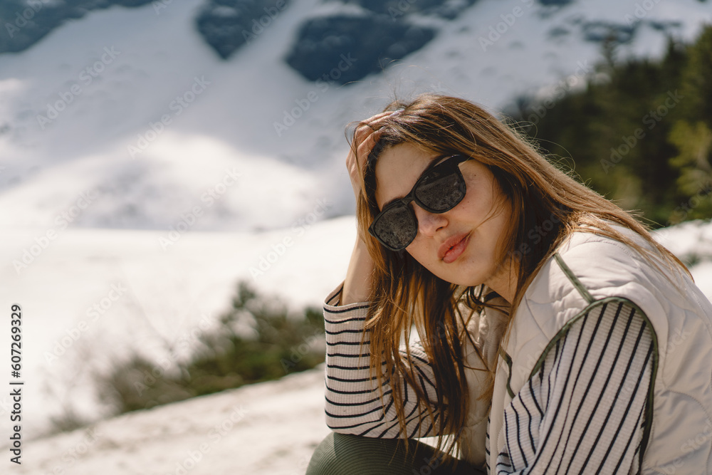 Portrait of a girl in the mountains traveling alone in the valley of the Tatra mountains in the country of Poland Portrait of a girl in the mountains traveling alone in the valley of the Tatra mountains in the country of Poland