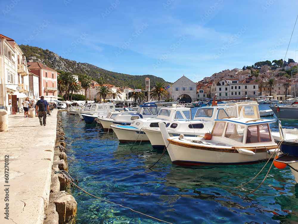 boats in harbour located at Hvar, Croatia against blue sky on a sunny day boats in harbour located at Hvar, Croatia against blue sky on a sunny day