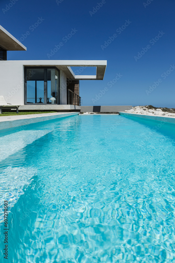 Lap pool outside modern house