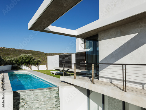 Balcony and lap pool of modern house © KOTO