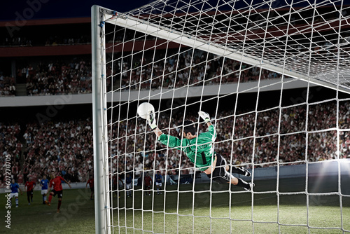Goalie defending soccer net on field