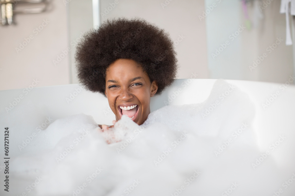 Woman laughing in bubble bath Woman laughing in bubble bath