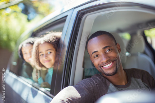 Portrait of happy family leaning out car windows © KOTO
