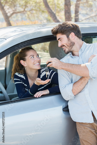 Photography Man giving woman in car keys