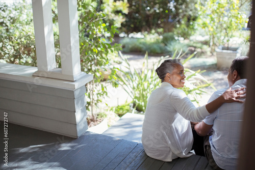 Photography Senior couple hugging on porch