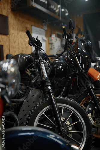 Motorcycles range in garage shop, repaired motorbikes ready for selling