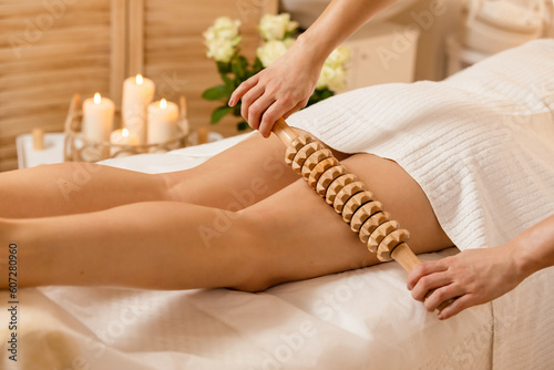 woman getting lymphatic drainage in spa salon, maderotheraphy , Anti-cellulite Massage
