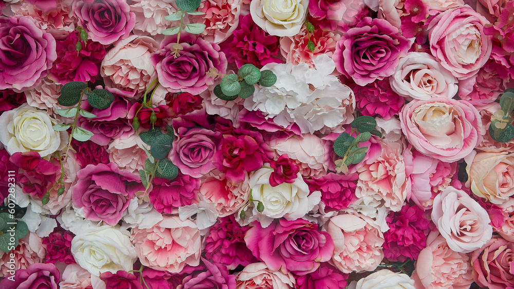 Flower wall background with pink roses.
