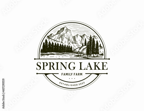 Lake and mountains logo vintage style hand drawn vector