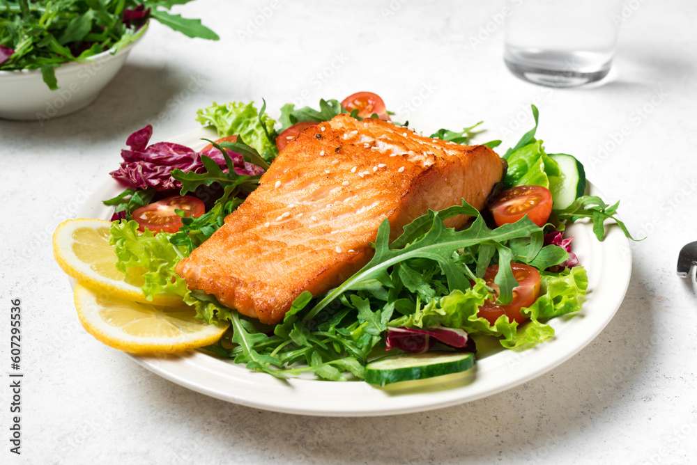 Grilled salmon fish fillet and green salad Grilled salmon fish fillet and green salad