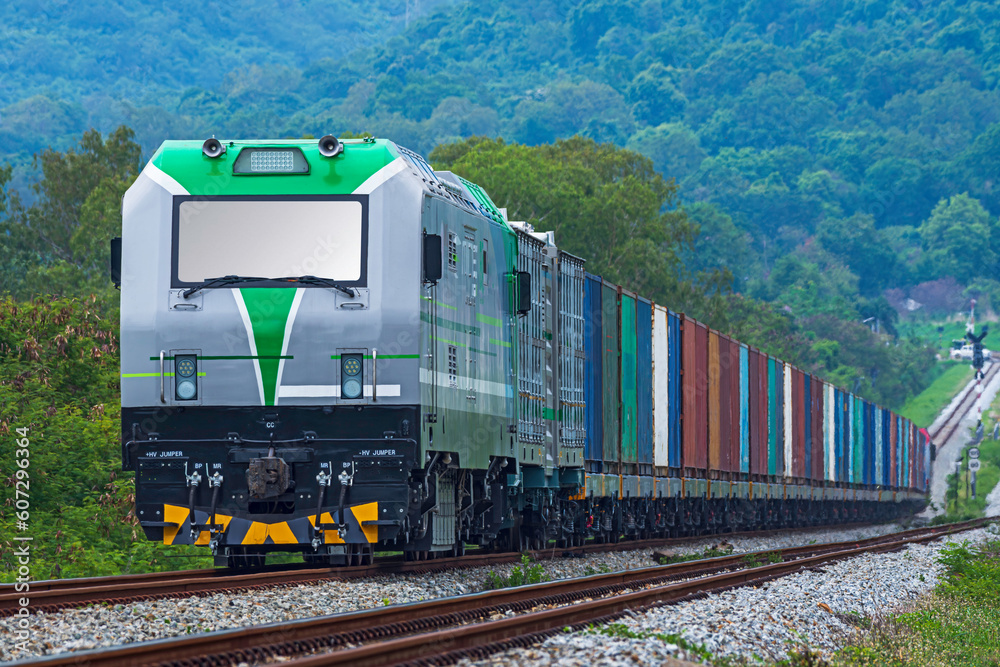 Obraz premium Train wagons carrying cargo containers for shipping companies. Distribution and freight transportation.