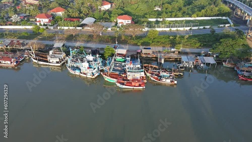 Aerial shot commercial ocean fishing boat floating on the river back to the harbour at morning time 