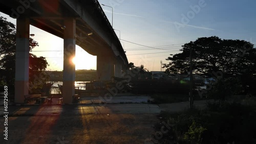 drone fly over bridge crosses even the river, Aerial view of cars driving on bridge in morning time at Chalermpragiad bridge Pattani,Thailand