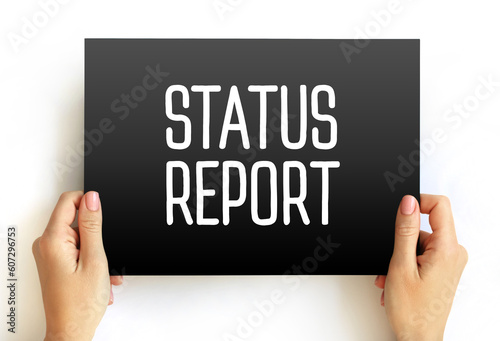 Status Report text on card, concept background