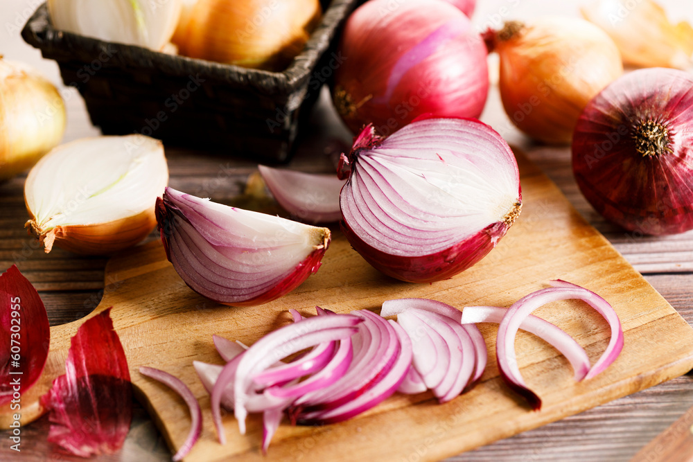 colorful onions on rustic wooden background. colorful onions on rustic wooden background.