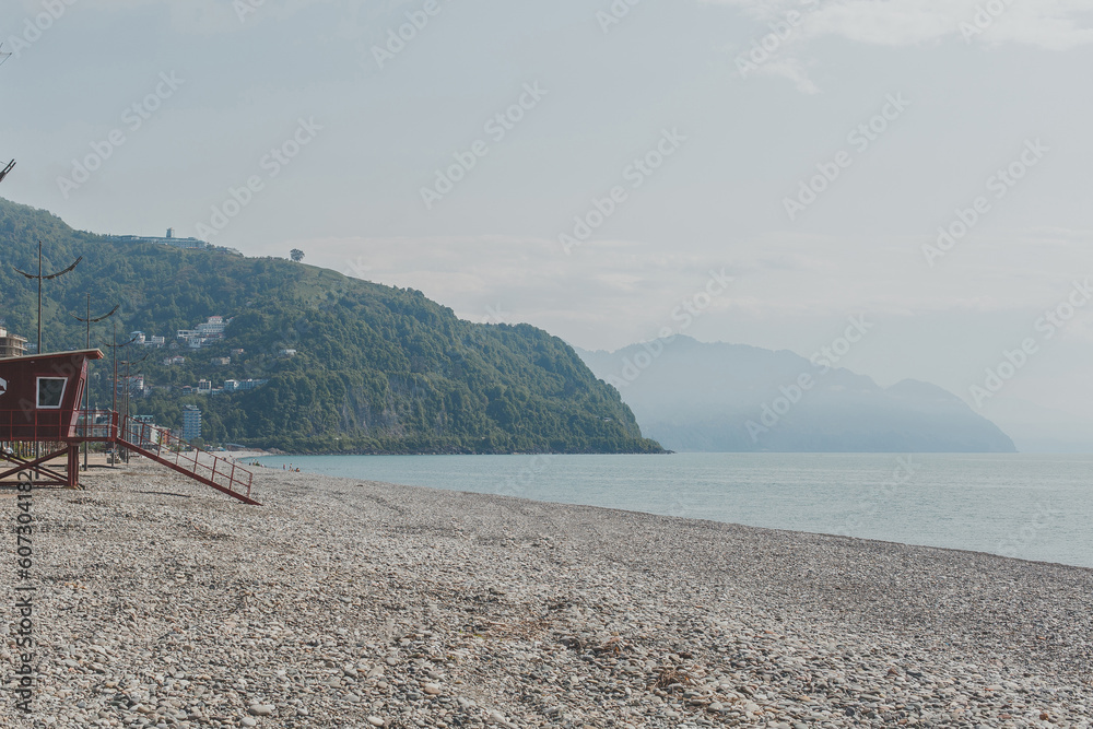 natural landscape of sea and green mountains, pebble beach, black sea Gonio village near Batumi, Georgia natural landscape of sea and green mountains, pebble beach, black sea Gonio village near Batumi, Georgia