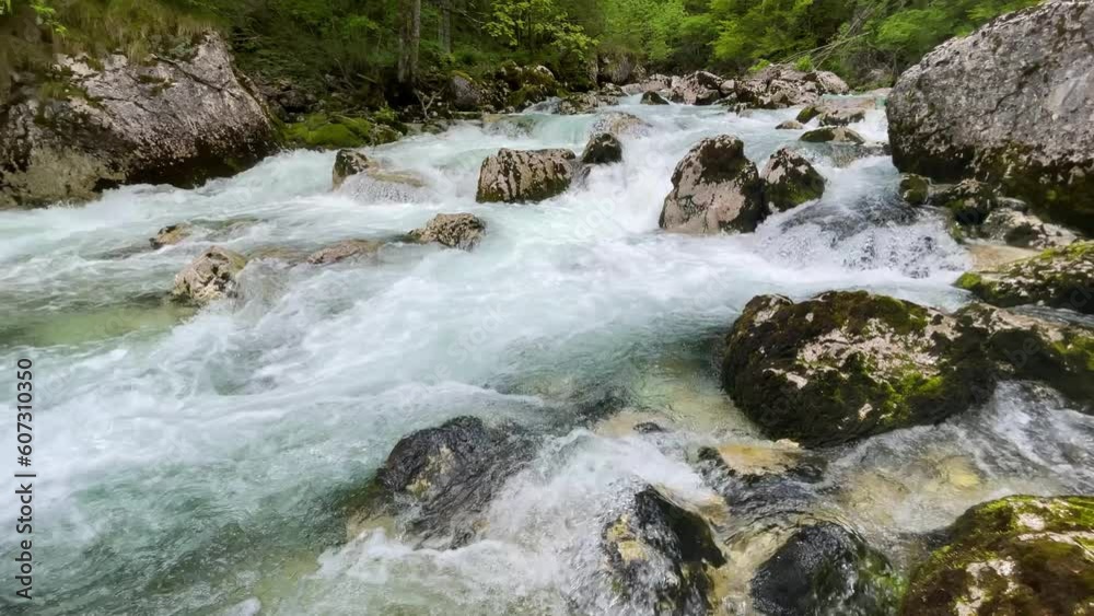 The flow of a mountain river in the stones The flow of a mountain river in the stones