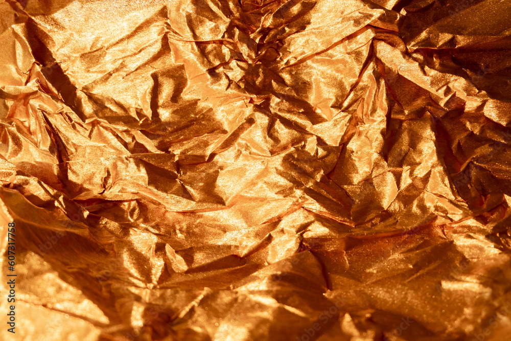 Crumpled Aluminum Foil Background Texture - in Gold Color Stock