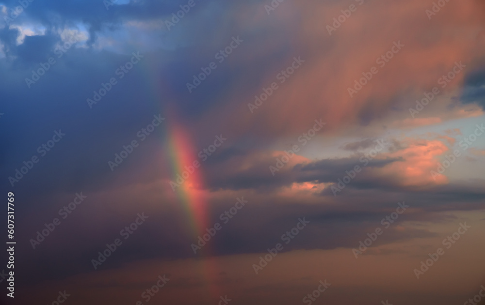 Natural colorful rainbow in clouds.
