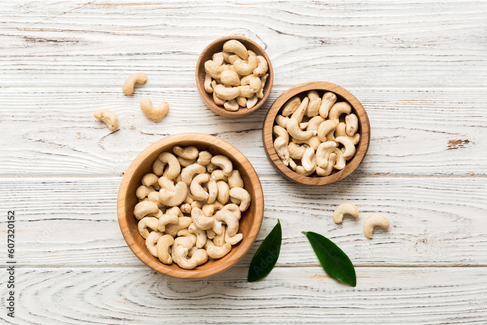cashew nuts in wooden bowl on table background. top view. Space for text Healthy food cashew nuts in wooden bowl on table background. top view. Space for text Healthy food