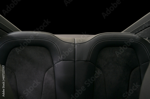 Rear leather seats. Sport car interior detail.