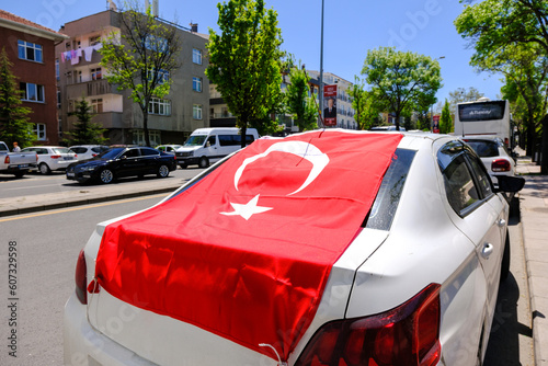 turkish flag on car rear window, turkish flag waving. A red flag hung on a car for celebration. 