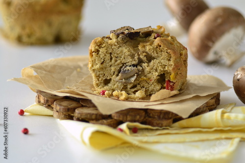 Muffin with mushrooms and cheese on cornmeal, snack muffin