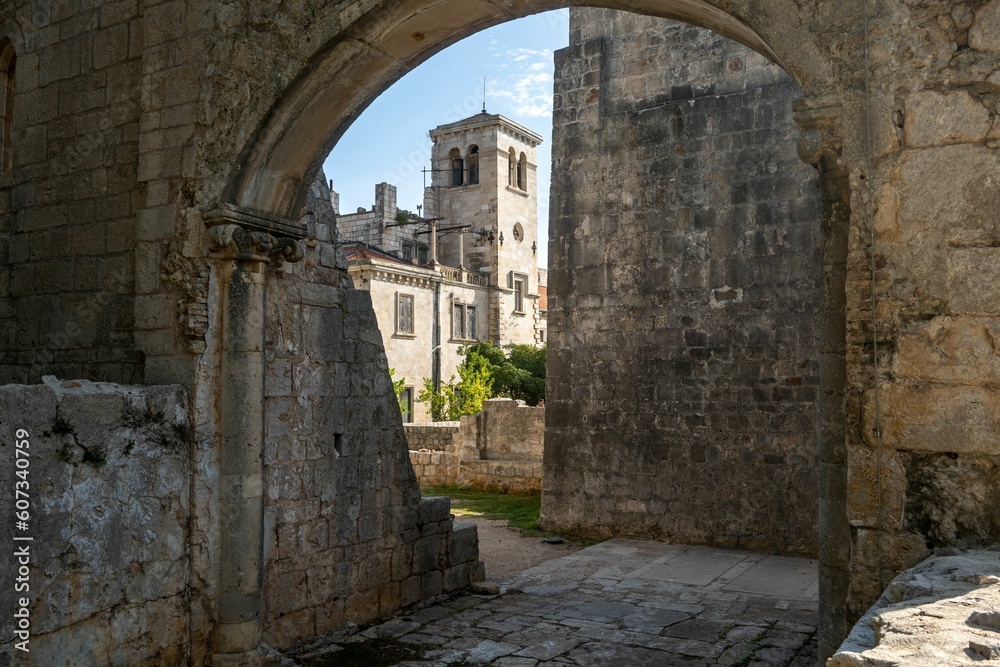 View of Benedictine monastery of St. Mary through an old stone gate in Lokrum Island, Croatia