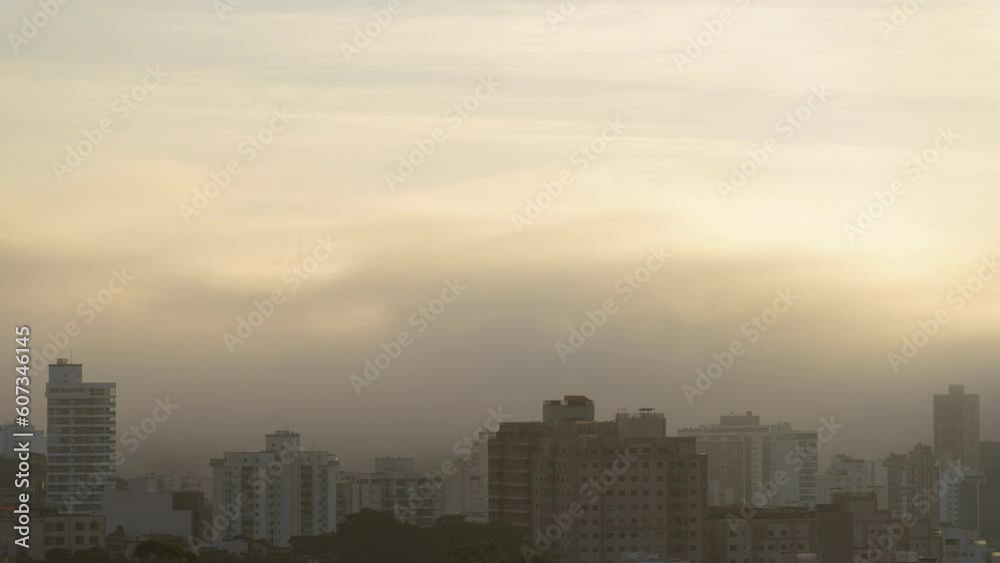 Mysterious Foggy Sunrise over Urban Skyline Mysterious Foggy Sunrise over Urban Skyline